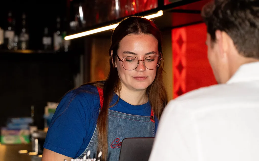 Bartender taking an order at the Bartronica bar